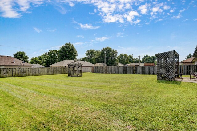 218 Tyler Ct, Mount Vernon, MO 65712 - fenced backyard featuring a gazebo