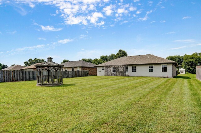 218 Tyler Ct, Mount Vernon, MO 65712 - fenced backyard with a gazebo