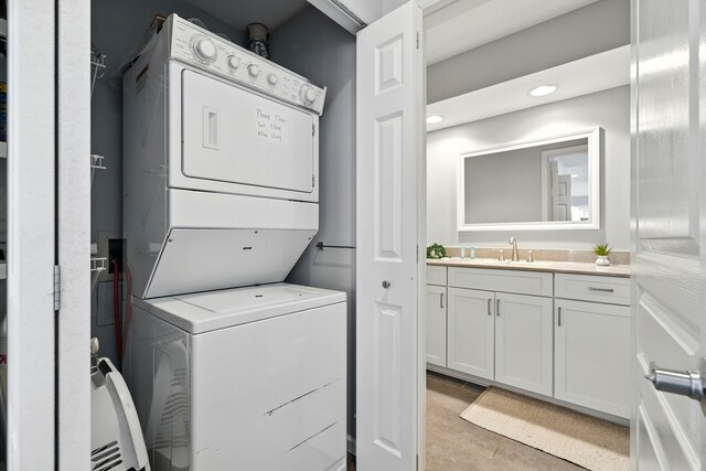 215 Meadow Brook Ln Unit 3, Branson, MO 65616 - laundry room with stacked washer and clothes dryer, light tile patterned floors, and recessed lighting