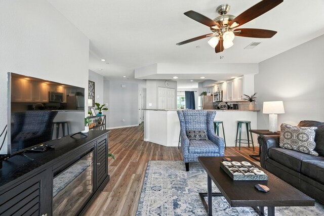 215 Meadow Brook Ln Unit 3, Branson, MO 65616 - living room with ceiling fan, wood finished floors, and recessed lighting