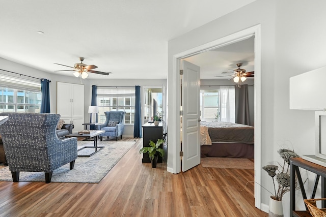 215 Meadow Brook Ln Unit 3, Branson, MO 65616 - living room featuring a ceiling fan, light wood finished floors, and healthy amount of natural light