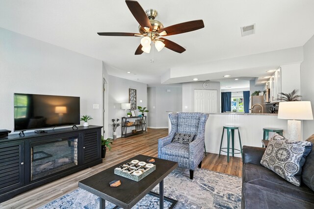 215 Meadow Brook Ln Unit 3, Branson, MO 65616 - living area with wood finished floors, a ceiling fan, and recessed lighting