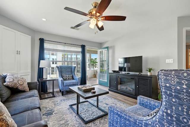 215 Meadow Brook Ln Unit 3, Branson, MO 65616 - living area with wood finished floors, a ceiling fan, recessed lighting, and a glass covered fireplace