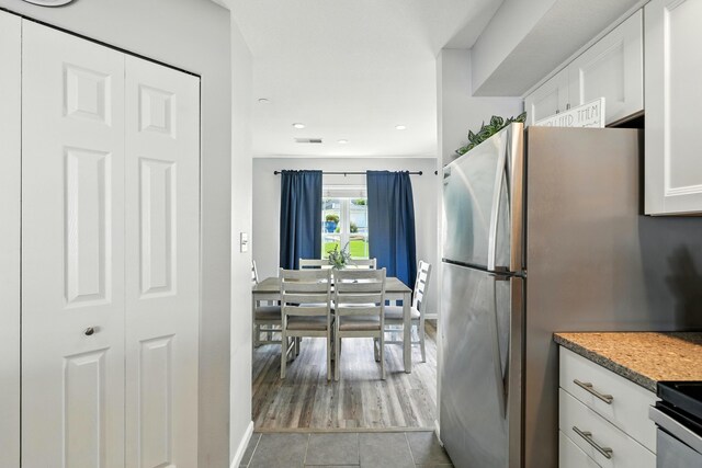 215 Meadow Brook Ln Unit 3, Branson, MO 65616 - kitchen featuring white cabinets, freestanding refrigerator, recessed lighting, and light tile patterned flooring