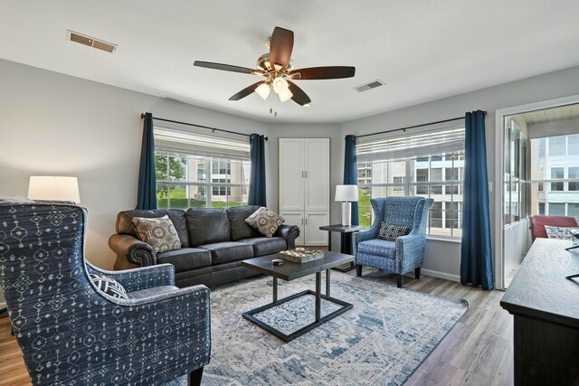 215 Meadow Brook Ln Unit 3, Branson, MO 65616 - living area featuring wood finished floors and a ceiling fan