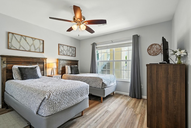 215 Meadow Brook Ln Unit 3, Branson, MO 65616 - bedroom featuring light wood finished floors and a ceiling fan
