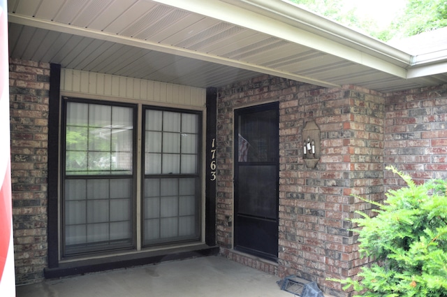 1761-1763 E Lark St, Springfield, MO 65804 - view of exterior entry with brick siding and a porch