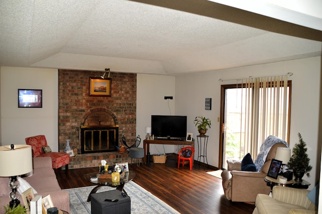 1761-1763 E Lark St, Springfield, MO 65804 - living area with wood finished floors, a fireplace, a raised ceiling, and a textured ceiling