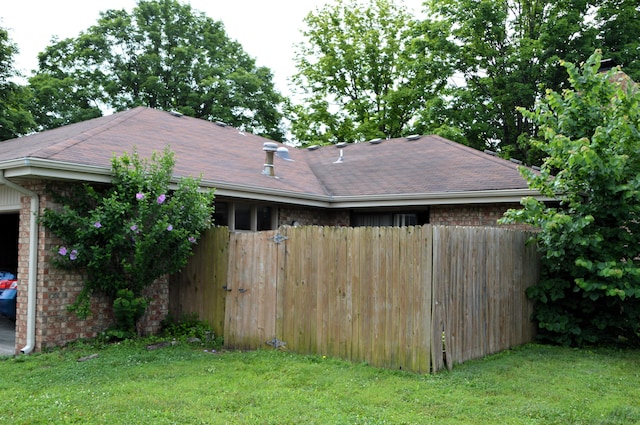 1761-1763 E Lark St, Springfield, MO 65804 - view of home's exterior featuring brick siding and roof with shingles
