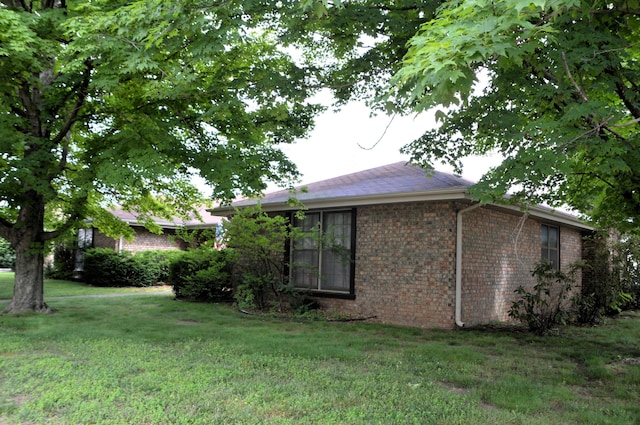 1761-1763 E Lark St, Springfield, MO 65804 - view of property exterior with brick siding and a yard