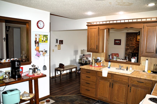 1761-1763 E Lark St, Springfield, MO 65804 - kitchen with light countertops, a textured ceiling, and brown cabinets