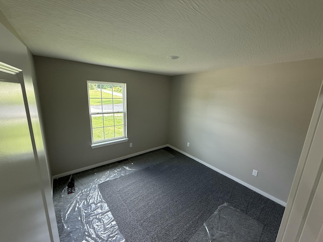 401 E Wright St, Willard, MO 65781 - spare room featuring baseboards and a textured ceiling