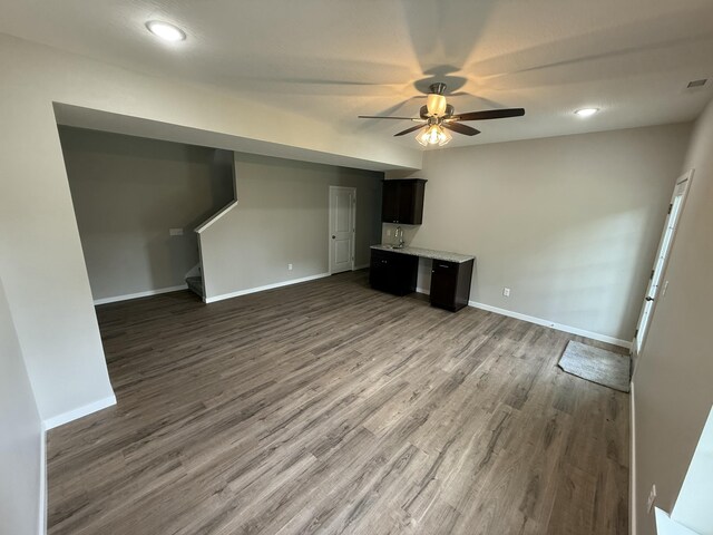401 E Wright St, Willard, MO 65781 - unfurnished living room with ceiling fan, stairs, dark wood-style flooring, and recessed lighting