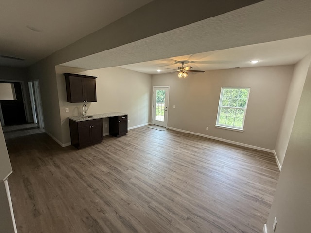 401 E Wright St, Willard, MO 65781 - unfurnished living room featuring healthy amount of natural light, wood finished floors, and ceiling fan