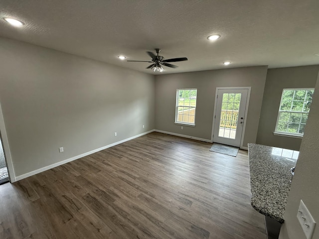 401 E Wright St, Willard, MO 65781 - unfurnished room with a ceiling fan, dark wood-style floors, recessed lighting, and a textured ceiling