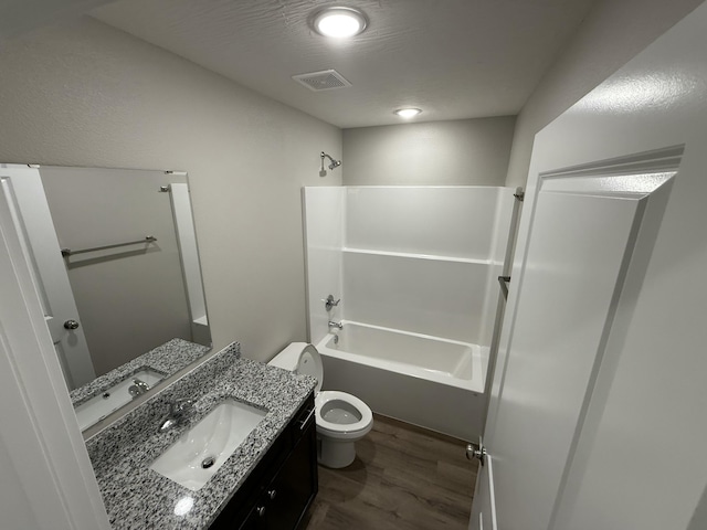 401 E Wright St, Willard, MO 65781 - full bathroom featuring wood finished floors, vanity, and bathtub / shower combination