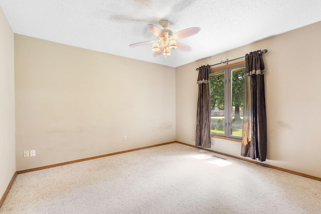1801 W Cherokee St, Springfield, MO 65807 - empty room with carpet floors, ceiling fan, and a textured ceiling