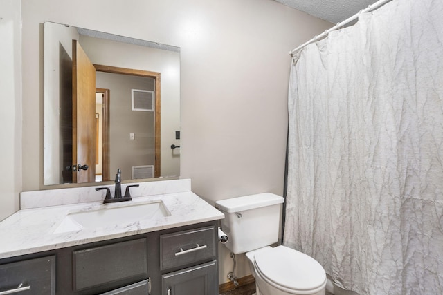 1801 W Cherokee St, Springfield, MO 65807 - bathroom with vanity and a textured ceiling