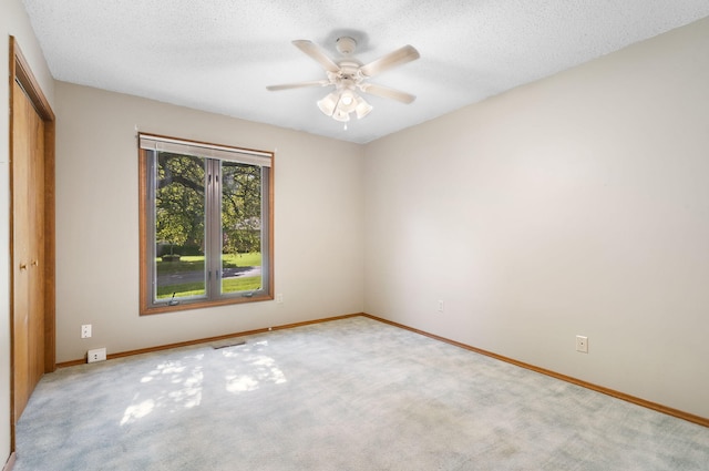 1801 W Cherokee St, Springfield, MO 65807 - carpeted empty room featuring a ceiling fan and a textured ceiling