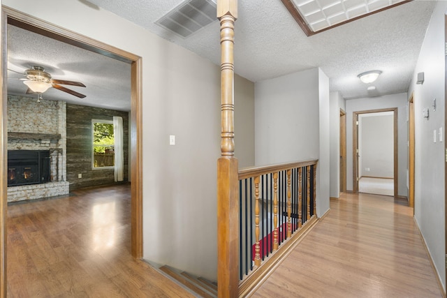 1801 W Cherokee St, Springfield, MO 65807 - hallway with a textured ceiling and wood finished floors