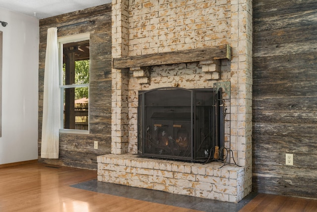 1801 W Cherokee St, Springfield, MO 65807 - detailed view of wood finished floors and a brick fireplace