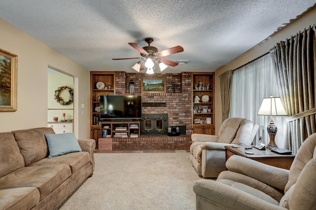 1706 Ankney Pl, Neosho, MO 64850 - living room featuring a textured ceiling, a ceiling fan, built in shelves, carpet flooring, and a wood stove