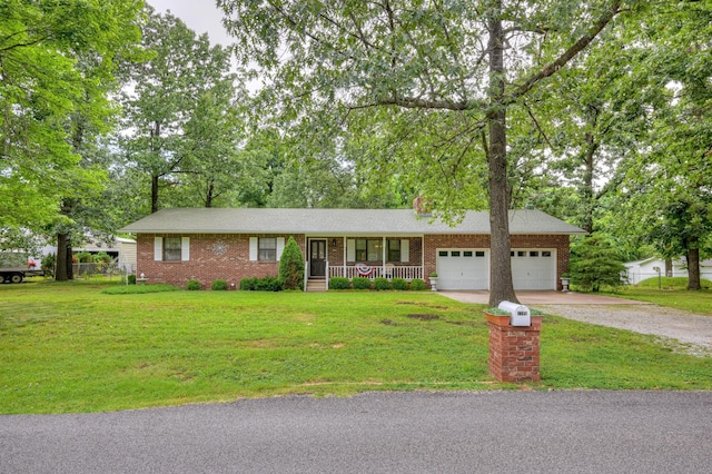 1706 Ankney Pl, Neosho, MO 64850 - ranch-style home with a porch, driveway, an attached garage, brick siding, and a front lawn