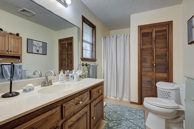 1706 Ankney Pl, Neosho, MO 64850 - full bathroom featuring a closet, vanity, a textured ceiling, tile patterned flooring, and curtained shower