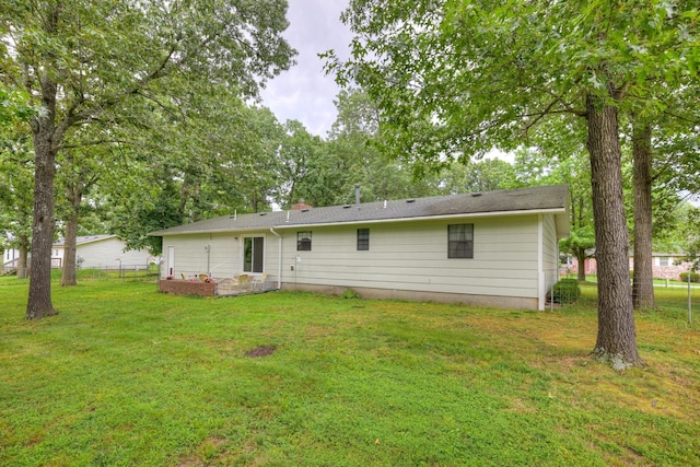 1706 Ankney Pl, Neosho, MO 64850 - rear view of property with a chimney