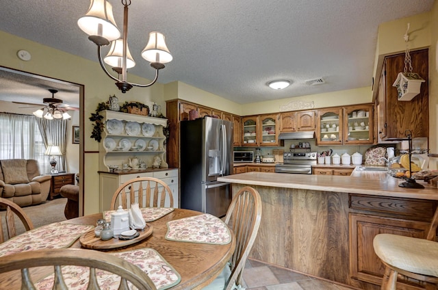 1706 Ankney Pl, Neosho, MO 64850 - dining space with a textured ceiling and a ceiling fan