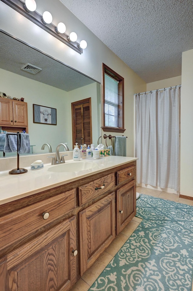 1706 Ankney Pl, Neosho, MO 64850 - full bathroom with a textured ceiling, tile patterned flooring, vanity, and a shower with curtain