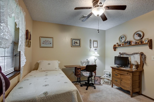 1706 Ankney Pl, Neosho, MO 64850 - bedroom with light colored carpet, a desk, a textured ceiling, and a ceiling fan