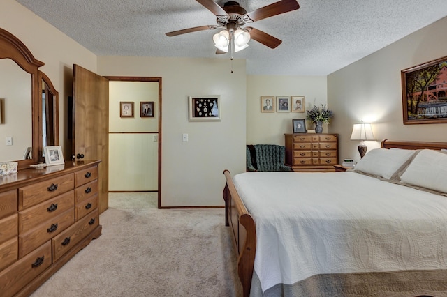 1706 Ankney Pl, Neosho, MO 64850 - bedroom with light carpet, a textured ceiling, and a ceiling fan
