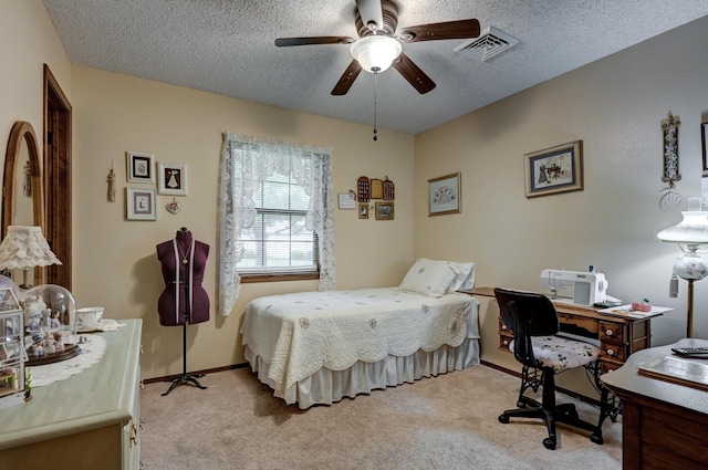 1706 Ankney Pl, Neosho, MO 64850 - bedroom featuring light carpet, a desk, a textured ceiling, and a ceiling fan