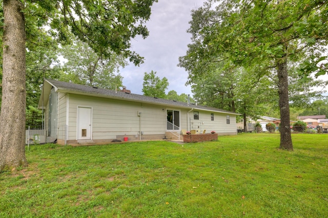 1706 Ankney Pl, Neosho, MO 64850 - back of house featuring entry steps and a chimney