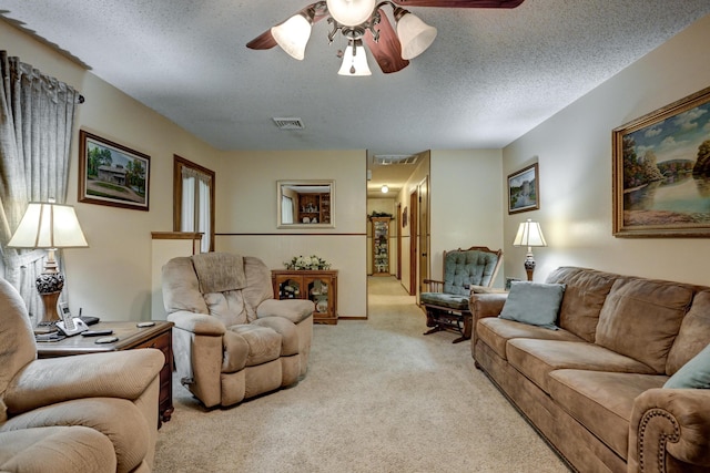1706 Ankney Pl, Neosho, MO 64850 - living room featuring light carpet, ceiling fan, and a textured ceiling