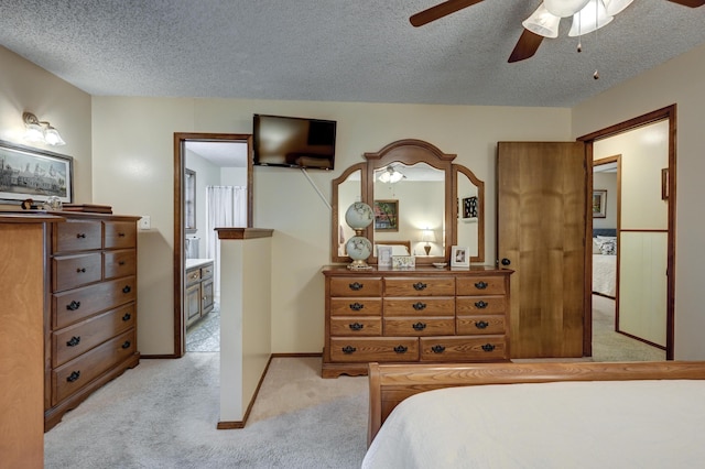 1706 Ankney Pl, Neosho, MO 64850 - bedroom featuring light carpet, a textured ceiling, and a ceiling fan