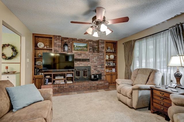 1706 Ankney Pl, Neosho, MO 64850 - living area with a wood stove, ceiling fan, a textured ceiling, carpet floors, and built in shelves