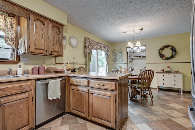 1706 Ankney Pl, Neosho, MO 64850 - kitchen with stainless steel dishwasher, a peninsula, brown cabinets, a chandelier, and light countertops