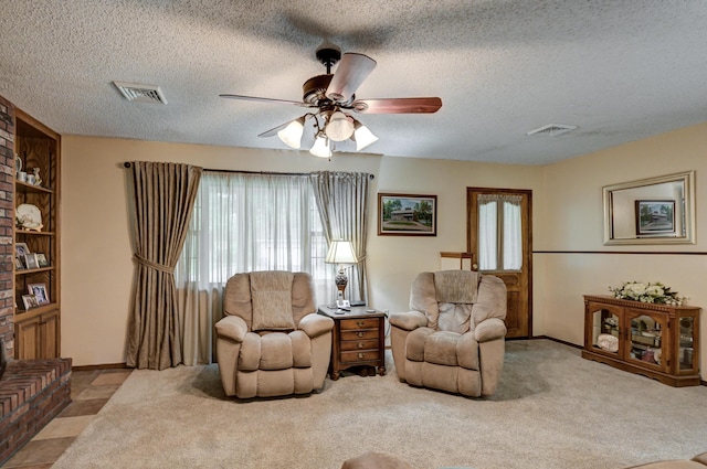 1706 Ankney Pl, Neosho, MO 64850 - living room with ceiling fan, a textured ceiling, and carpet flooring