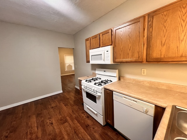 1322 W Atlantic St, Springfield, MO 65803 - kitchen with white appliances, light countertops, dark wood finished floors, brown cabinetry, and a textured ceiling