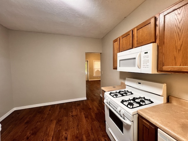 1322 W Atlantic St, Springfield, MO 65803 - kitchen with white appliances, dark wood-style flooring, light countertops, brown cabinets, and a textured ceiling