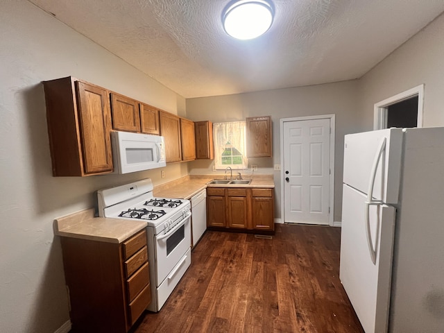 1322 W Atlantic St, Springfield, MO 65803 - kitchen featuring white appliances, dark wood-style flooring, brown cabinetry, and light countertops