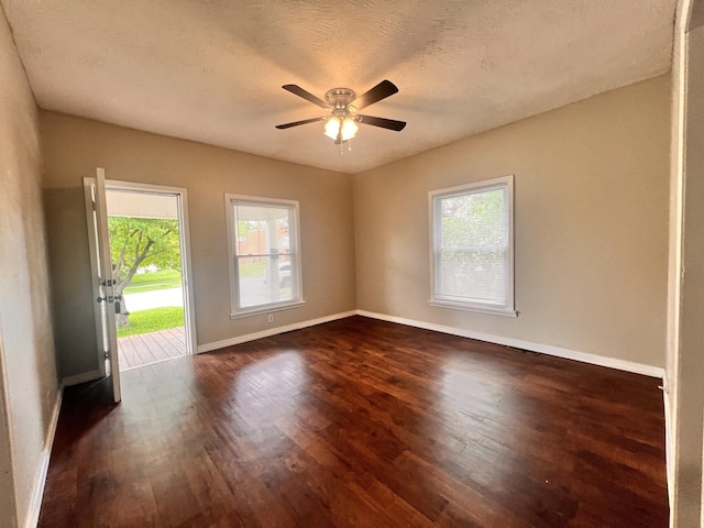 1322 W Atlantic St, Springfield, MO 65803 - spare room with dark wood-style flooring, a ceiling fan, and plenty of natural light