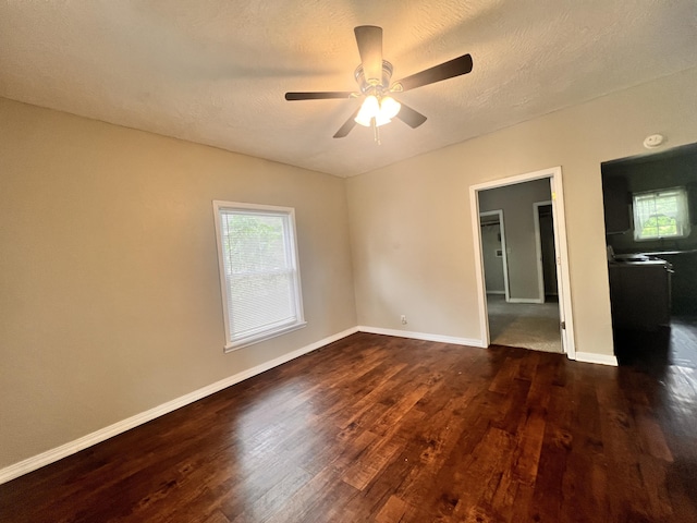 1322 W Atlantic St, Springfield, MO 65803 - empty room featuring dark wood finished floors, a ceiling fan, and a textured ceiling