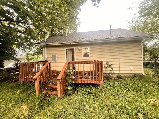 1322 W Atlantic St, Springfield, MO 65803 - rear view of house featuring a deck and a shingled roof