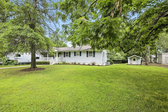 601 Linzee Blvd, Pierce City, MO 65723 - single story home with a storage unit, covered porch, a front lawn, and board and batten siding