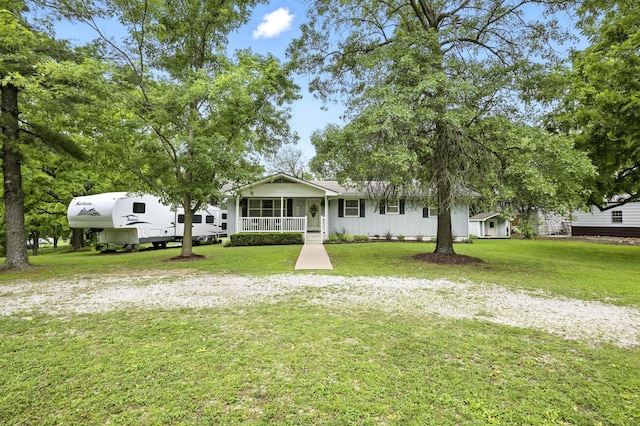 601 Linzee Blvd, Pierce City, MO 65723 - view of front facade with covered porch, a front yard, and board and batten siding