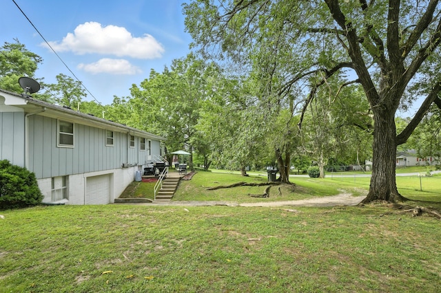 601 Linzee Blvd, Pierce City, MO 65723 - view of grassy yard with a garage