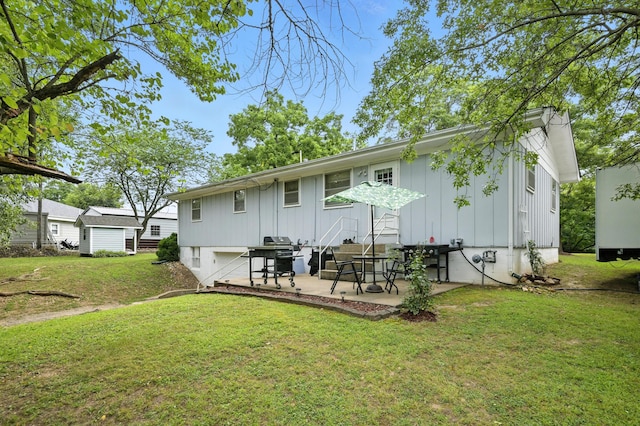 601 Linzee Blvd, Pierce City, MO 65723 - back of house featuring board and batten siding, a patio, a yard, and an attached garage